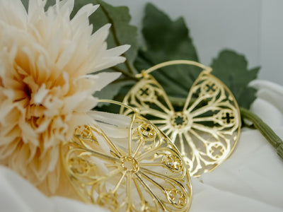 oracle gold hoop ornate earring, inspired by church glass or architecture 