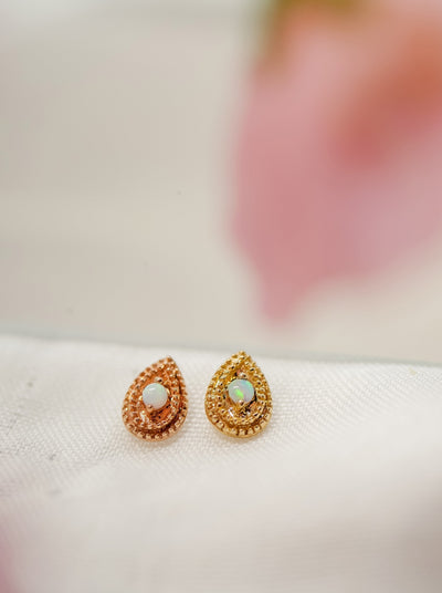 rose or yellow gold tear drop shaped millgrain with white opal ends