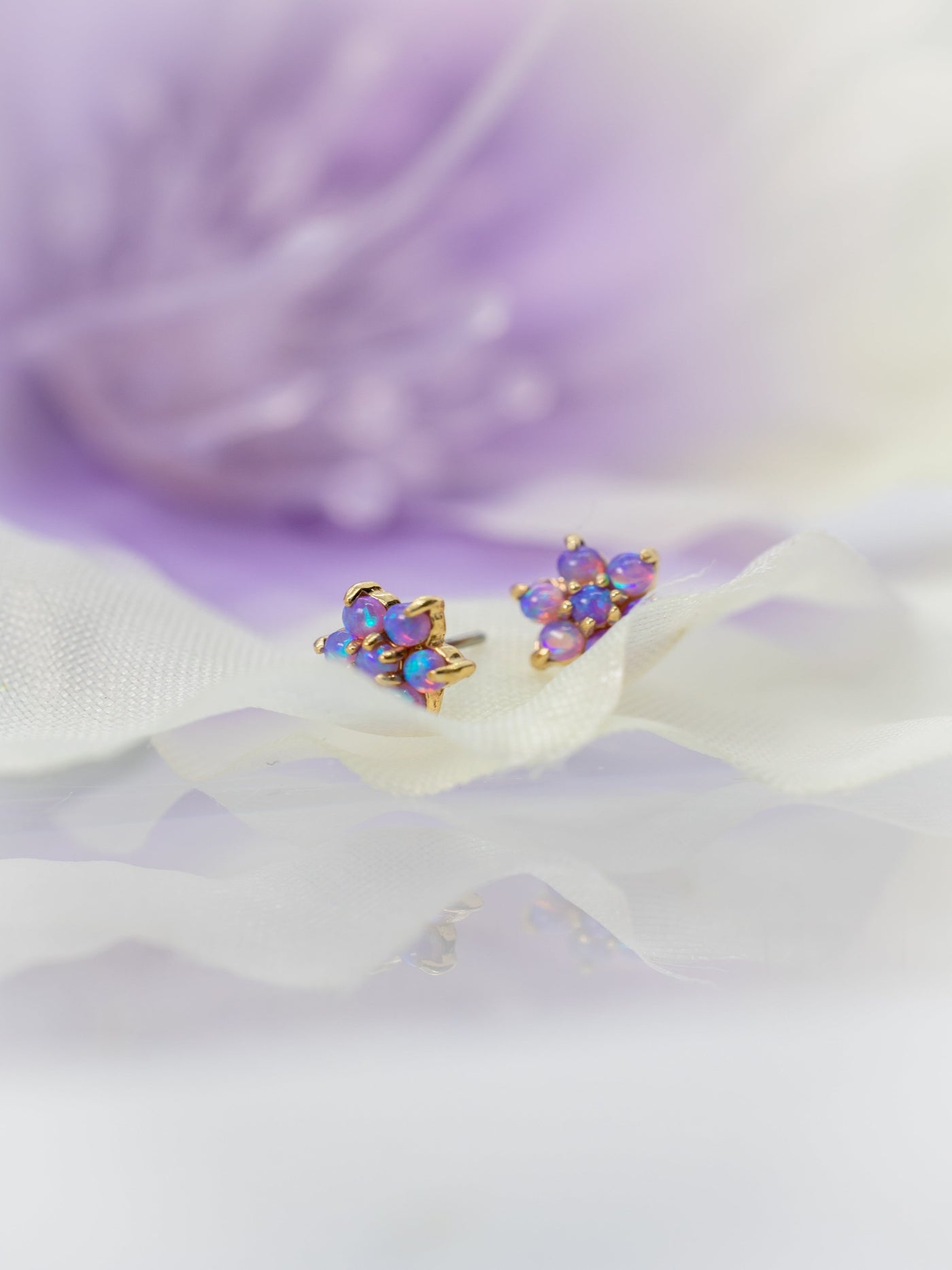 purple flower set in opal and yellow gold large floral ends