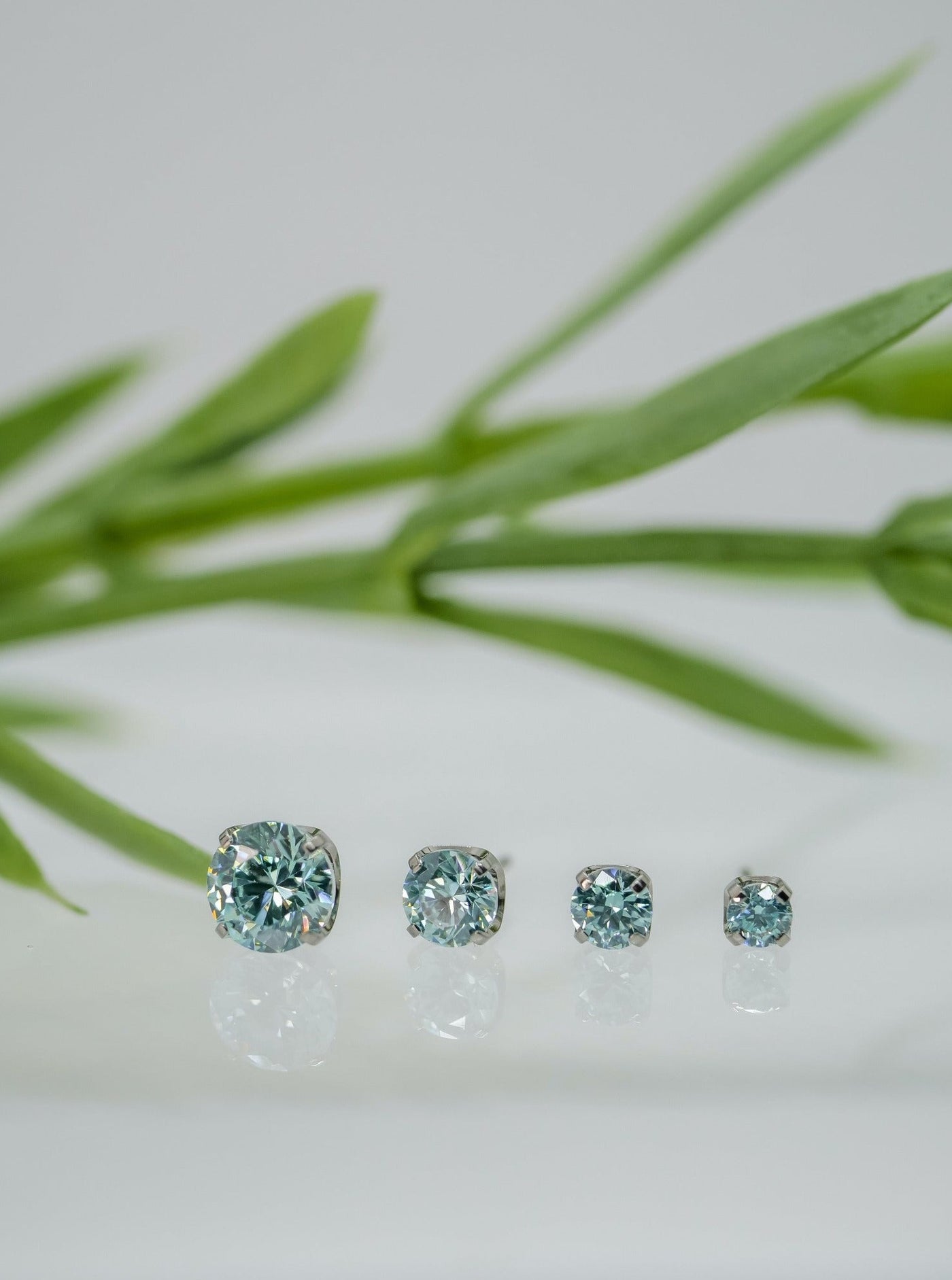 mint green cubic zirconias in prong settings ranging from 1.5mm to 4mm